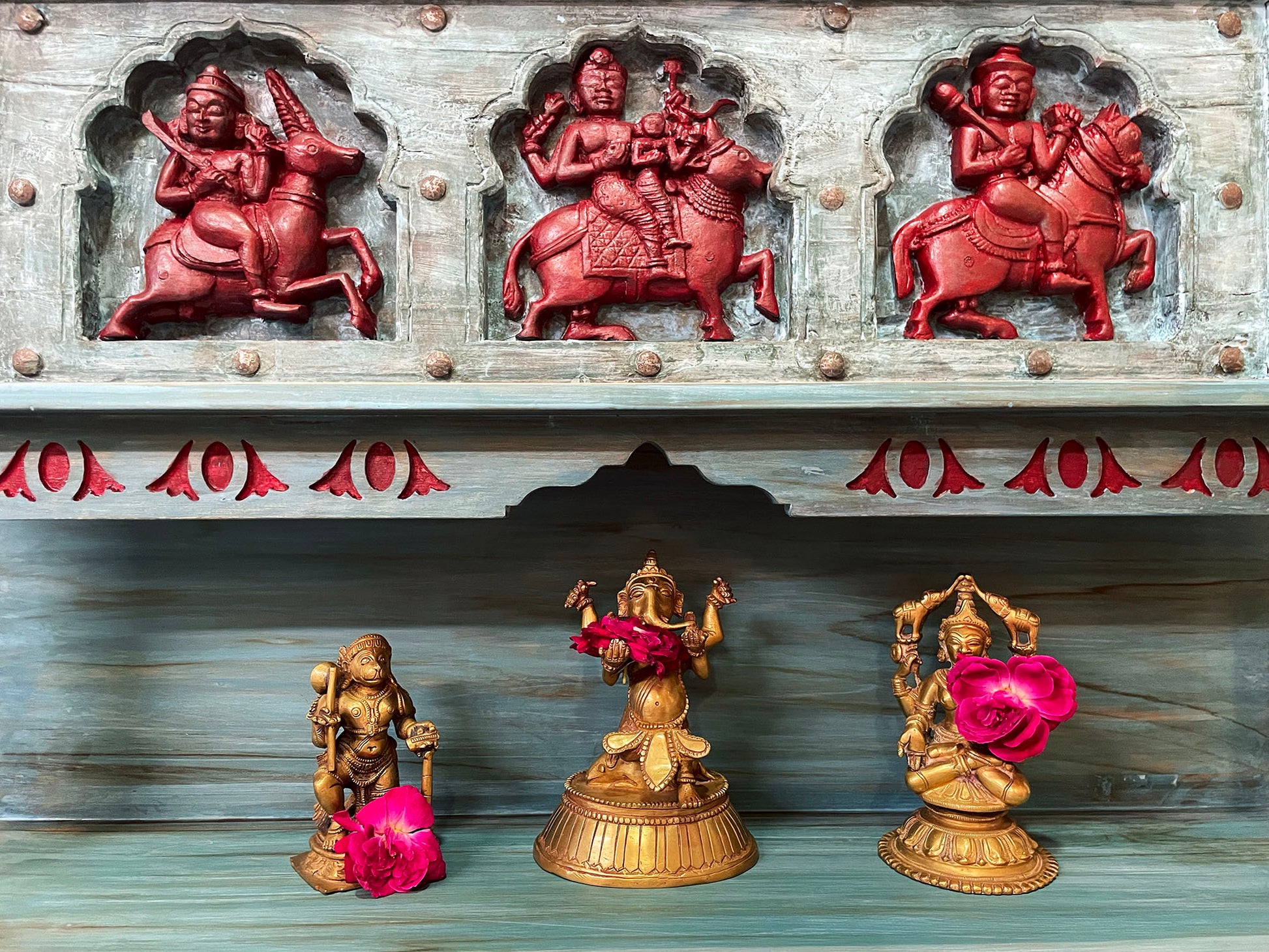 Wall hung temple with three god sculptures